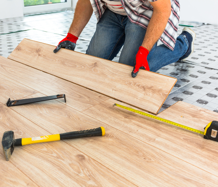 Man Installing Wooden Floor